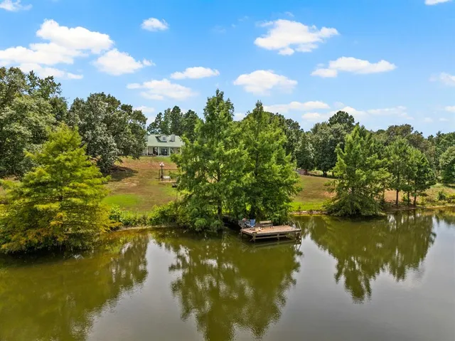 a view of ocean with green space