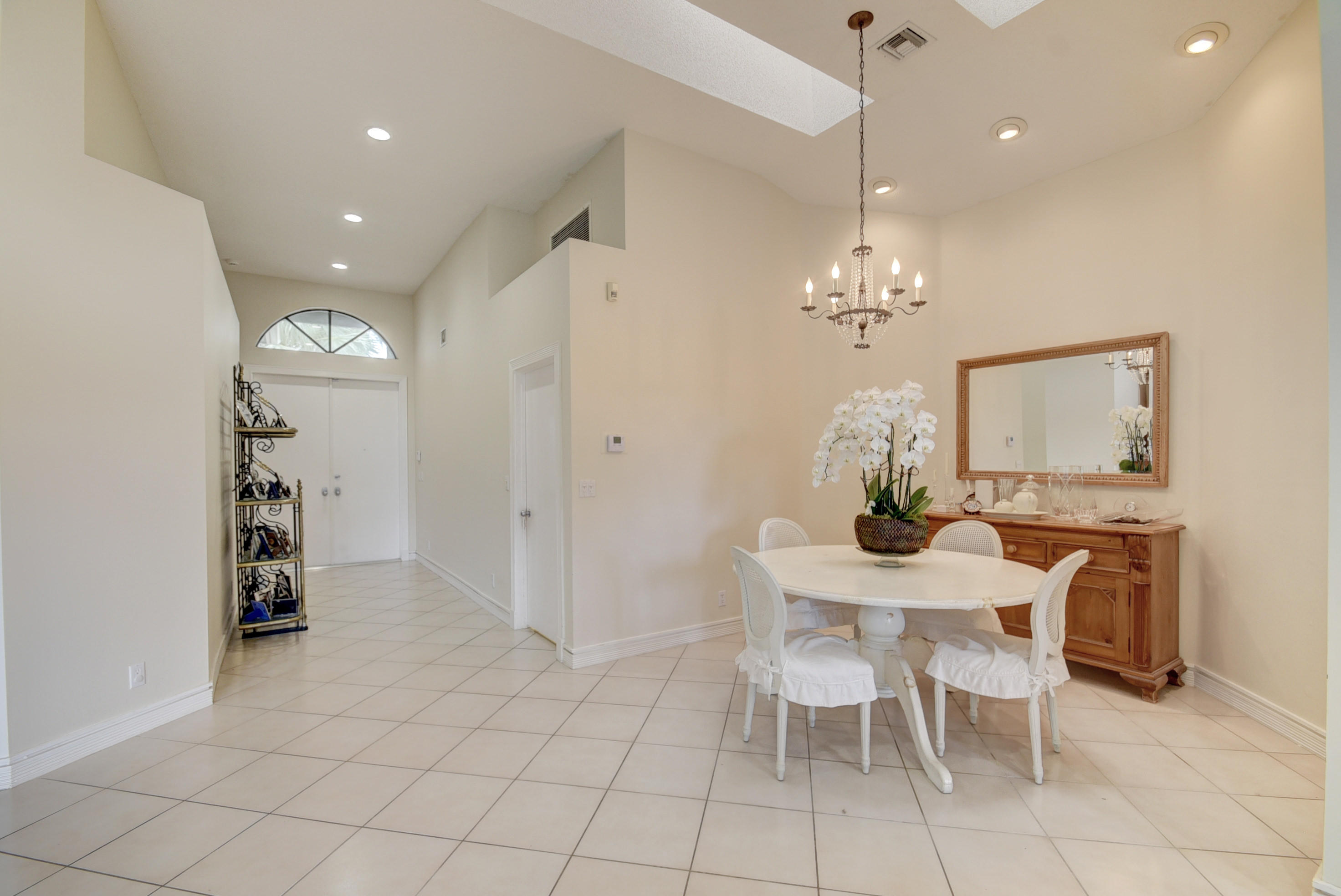 4426 Northwest 29th Way Boca Raton, FL 33434 - Photo 4 of 23 a view of a dining room with furniture and chandelier
