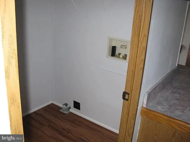 a view of front door with wooden floor