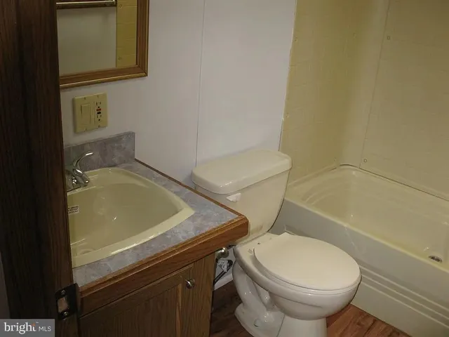a bathroom with a sink and toilet