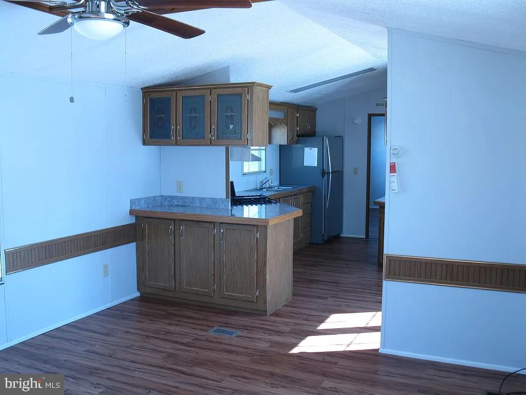 1910 Schubert Road, Unit 19 Bethel, PA 19507 - Photo 3 of 14 a kitchen with stainless steel appliances granite countertop a sink stove and cabinets