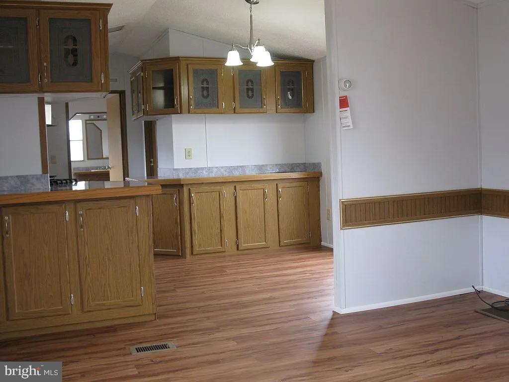 1910 Schubert Road, Unit 19 Bethel, PA 19507 - Photo 4 of 14 a kitchen with stainless steel appliances granite countertop a sink and a granite counter tops