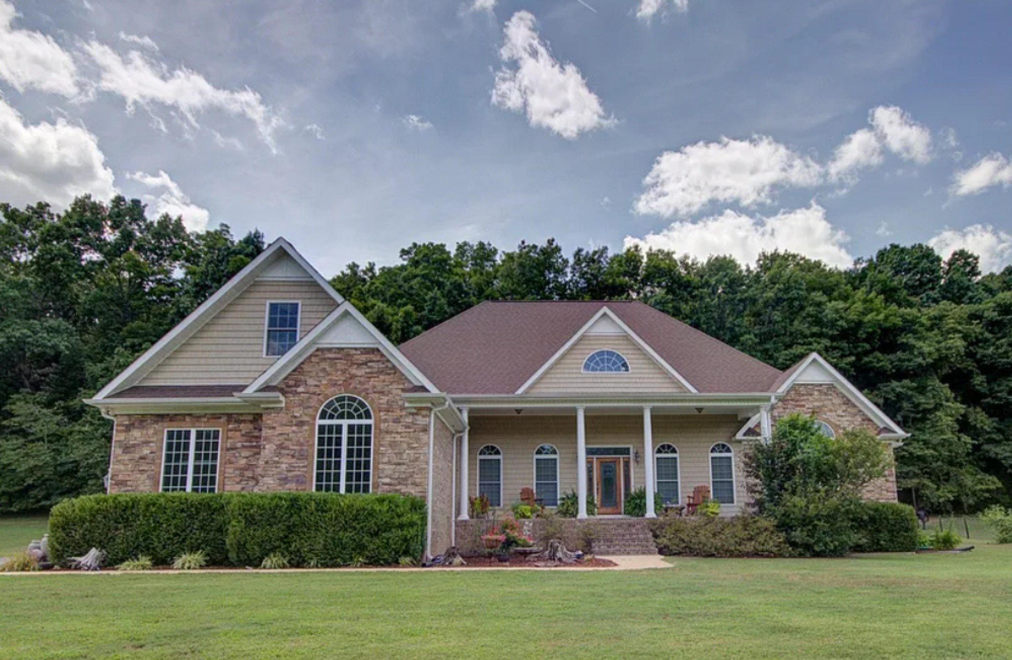 a front view of a house with a yard
