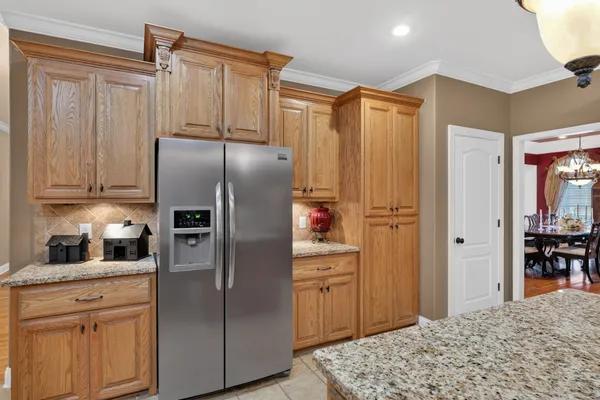 a kitchen with counter top space cabinets and stainless steel appliances