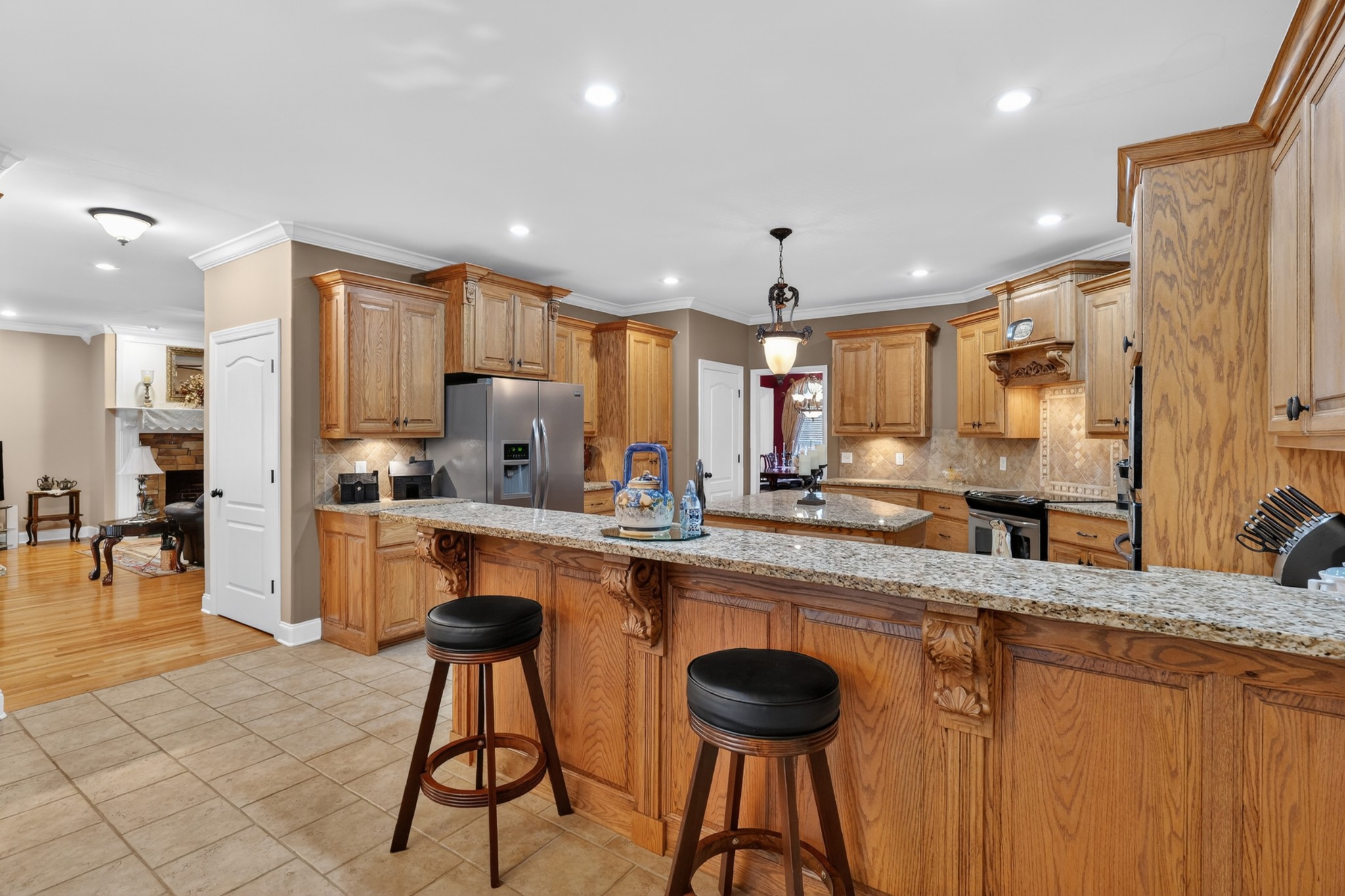 600 Bates Hollow Road Prospect, TN 38477 - Photo 17 of 68 a kitchen with stainless steel appliances granite countertop white cabinets a sink stove and a refrigerator
