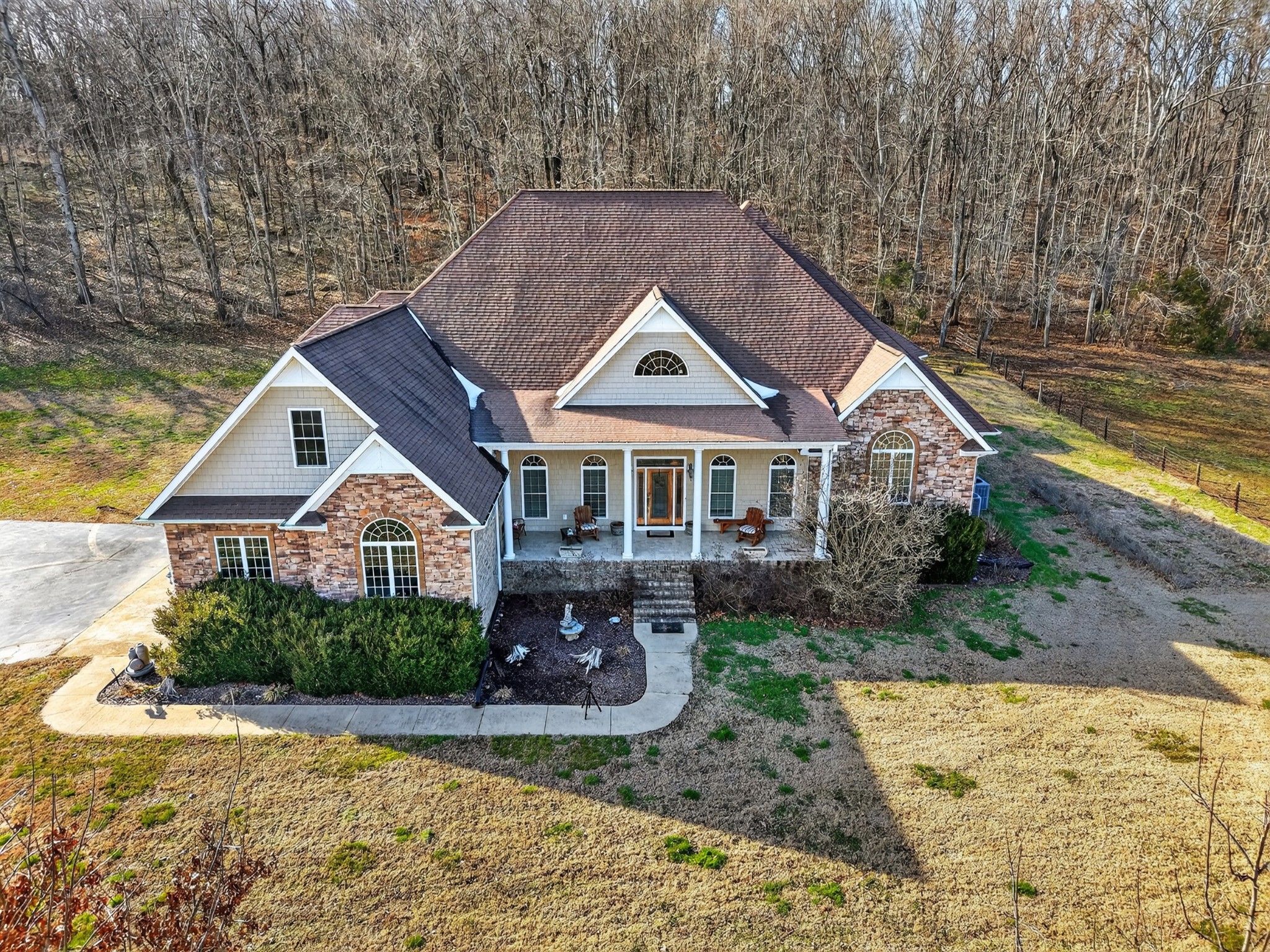 600 Bates Hollow Road Prospect, TN 38477 - Photo 2 of 68 a front view of a house with a yard and lake view