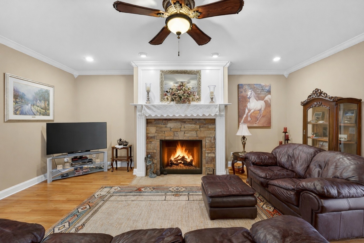 600 Bates Hollow Road Prospect, TN 38477 - Photo 29 of 73 a living room with furniture a flat screen tv and a fireplace