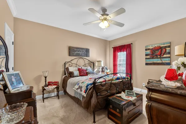 a very nice looking room with a large window and furniture