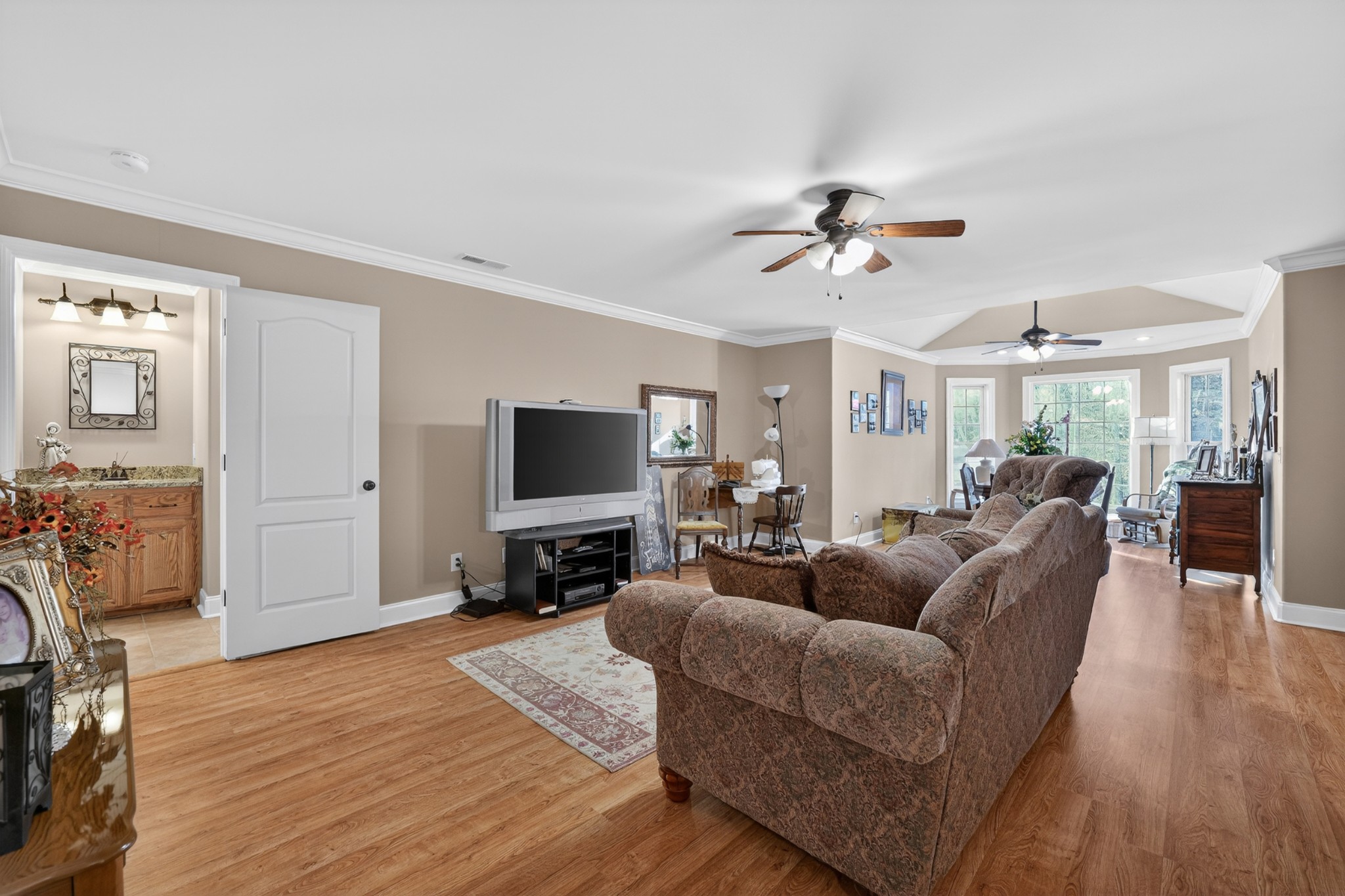 600 Bates Hollow Road Prospect, TN 38477 - Photo 40 of 68 a living room with furniture a ceiling fan and a flat screen tv