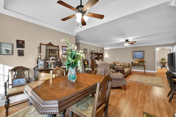 a bedroom with furniture and wooden floor