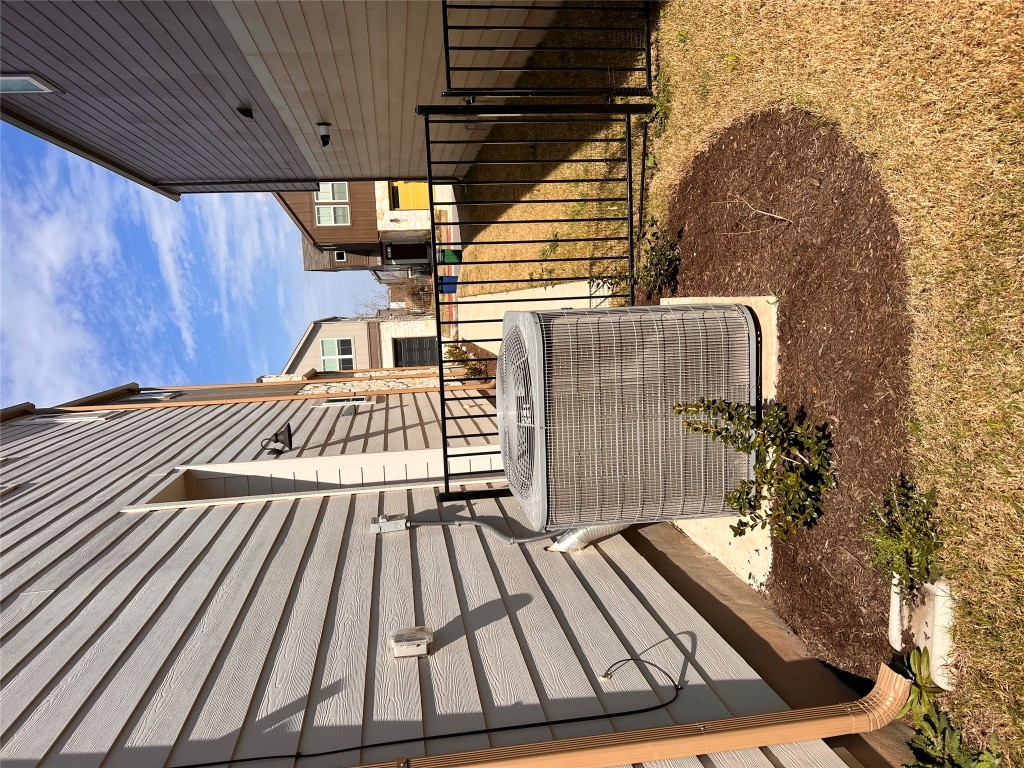 7103 Terrazzo Cottage Lane, Unit 33 Austin, TX 78744 - Photo 12 of 14 a view of a porch with a bench