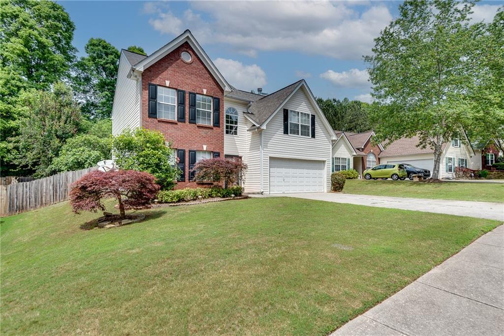 3337 Baymount Way Lawrenceville, GA 30043 - Photo 3 of 47 a front view of a house with garden