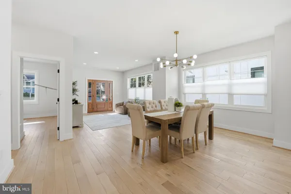 a kitchen with kitchen island a counter top space a sink stainless steel appliances and cabinets