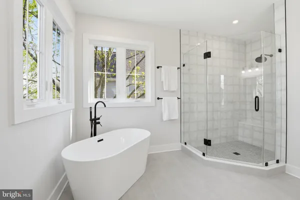a bathroom with a sink toilet and bathtub