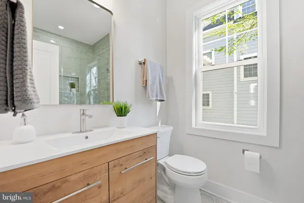 a bathroom with a glass shower door