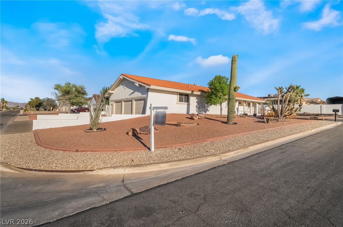 429 Crestway Road Henderson, NV 89015 - Photo 4 of 56 A well-maintained desert landscape surrounds this charming single-story residence with a distinctive tile roof.