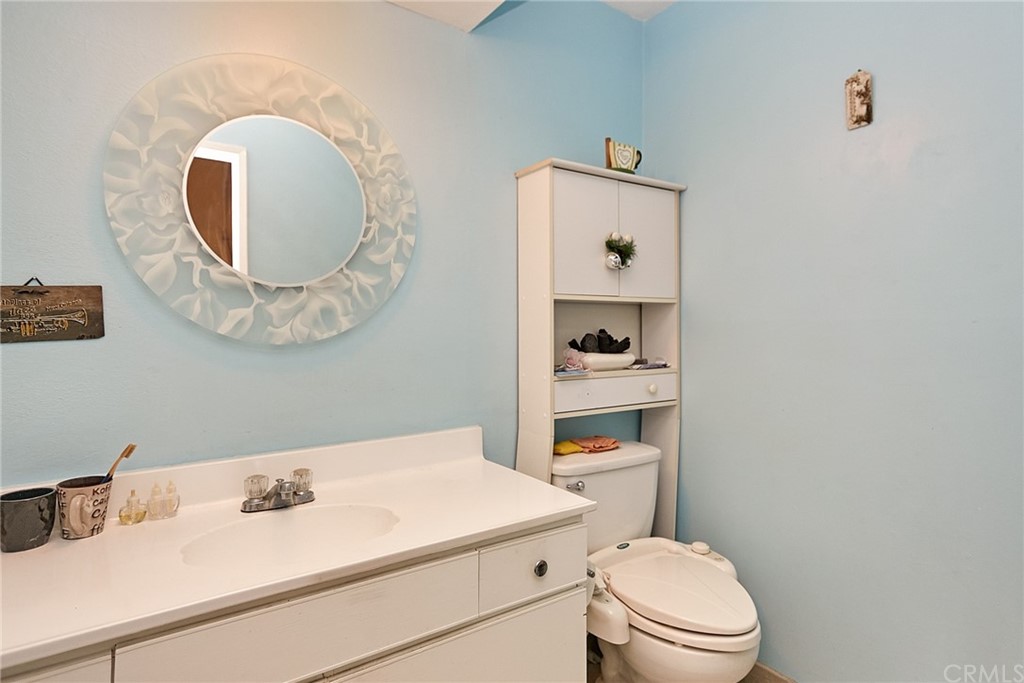 334 Miraleste Drive, Unit 237 San Pedro, CA 90732 - Photo 11 of 20 a bathroom with a sink mirror and toilet
