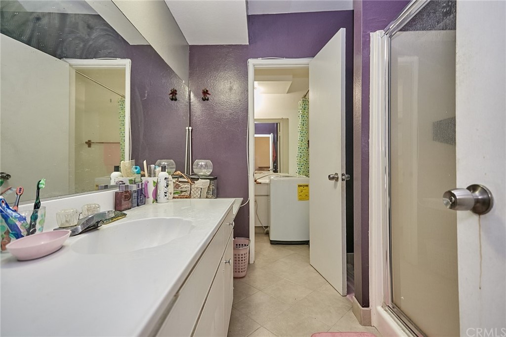 334 Miraleste Drive, Unit 237 San Pedro, CA 90732 - Photo 14 of 20 a bathroom with a sink and mirror with shower