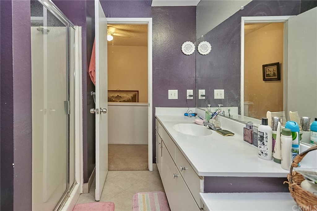 334 Miraleste Drive, Unit 237 San Pedro, CA 90732 - Photo 15 of 20 a bathroom with a sink a mirror and a shower