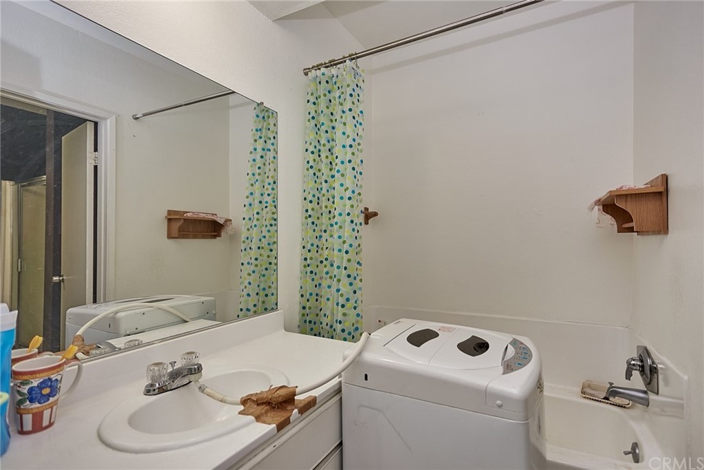 334 Miraleste Drive, Unit 237 San Pedro, CA 90732 - Photo 16 of 20 a bathroom with a sink toilet and shower