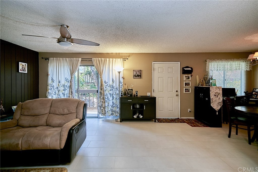 334 Miraleste Drive, Unit 237 San Pedro, CA 90732 - Photo 9 of 20 a living room with furniture and a window