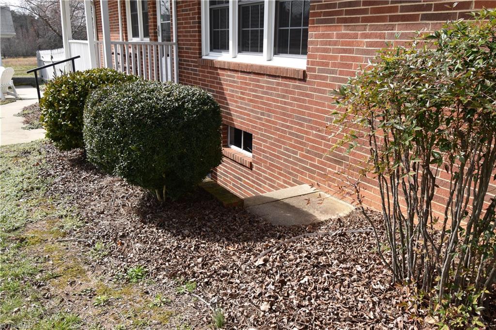 6556 Foster Road Whitsett, NC 27377 - Photo 5 of 27 Outside entrance to basement.