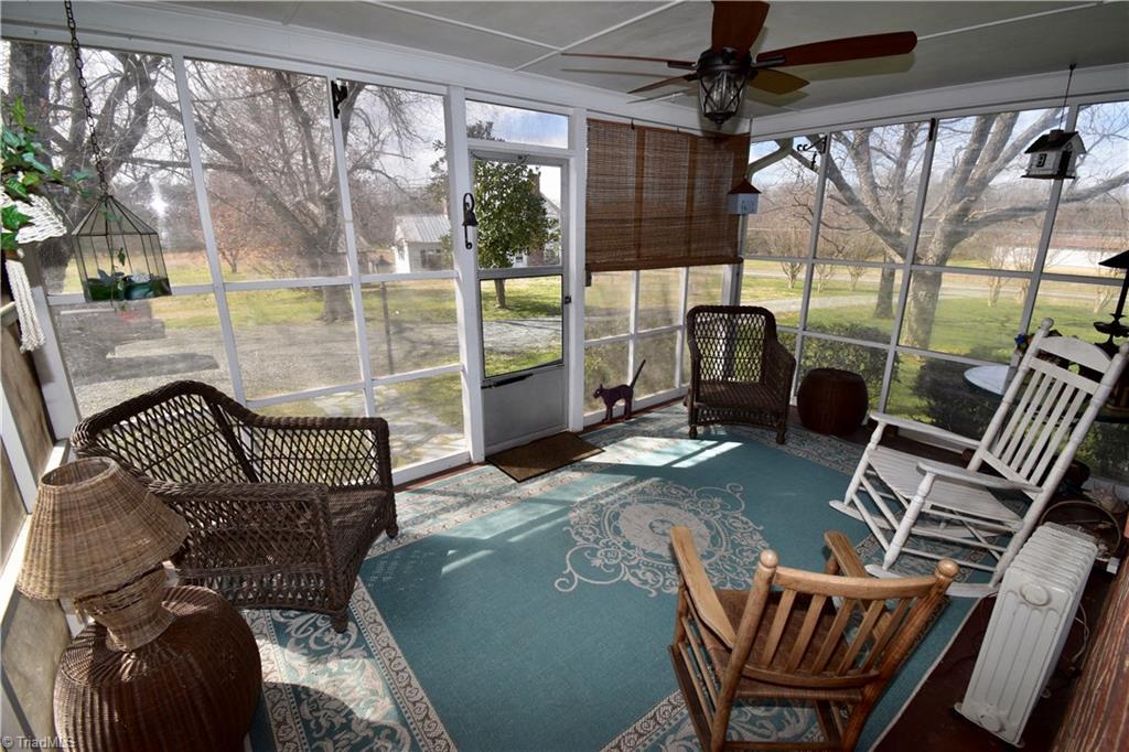 6556 Foster Road Whitsett, NC 27377 - Photo 6 of 27 Screened porch.