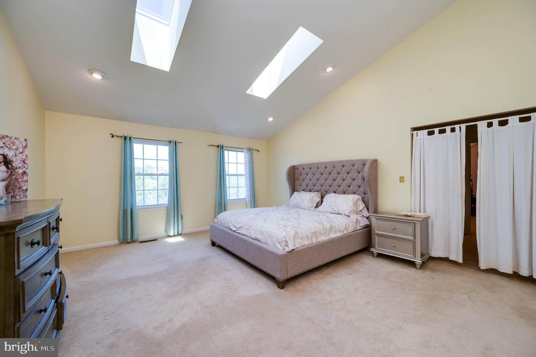 4660 Dunham Drive Reading, PA 19606 - Photo 23 of 48 a spacious bedroom with a bed and a window
