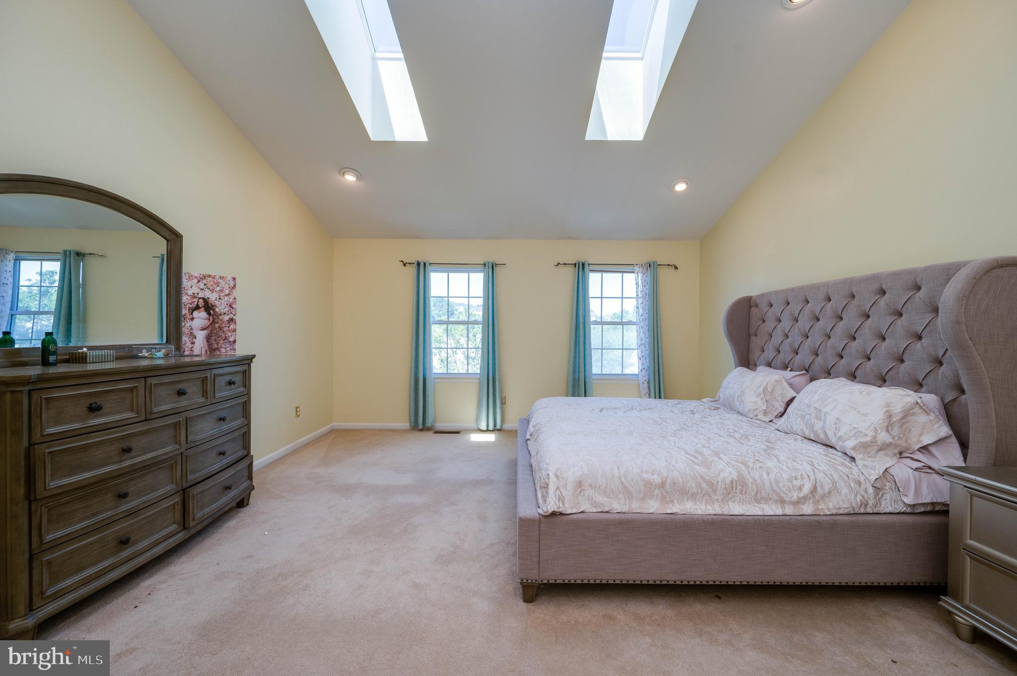 4660 Dunham Drive Reading, PA 19606 - Photo 24 of 48 a bedroom with a bed and a mirror on dresser