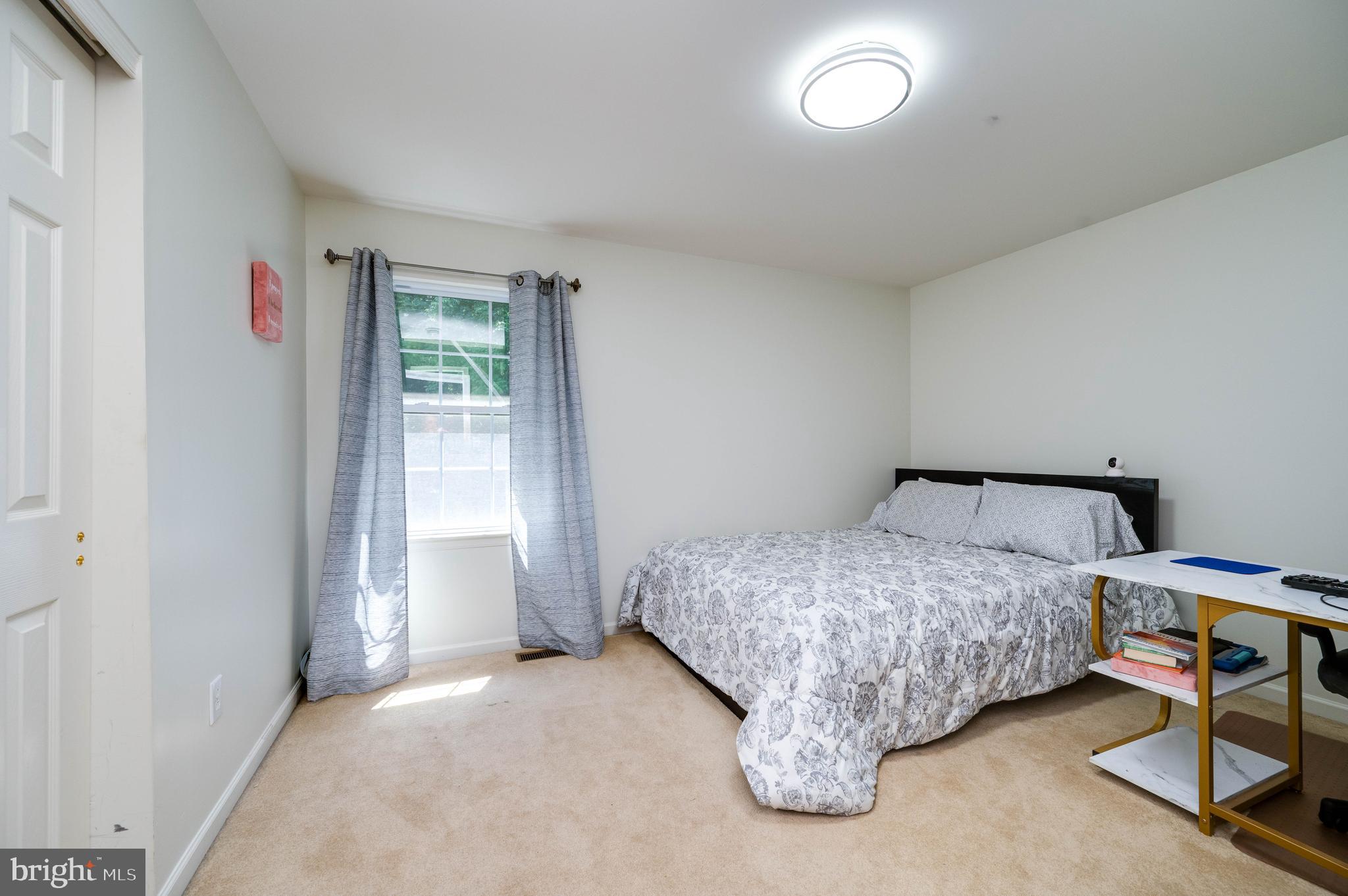 4660 Dunham Drive Reading, PA 19606 - Photo 32 of 48 a bedroom with a bed and a window