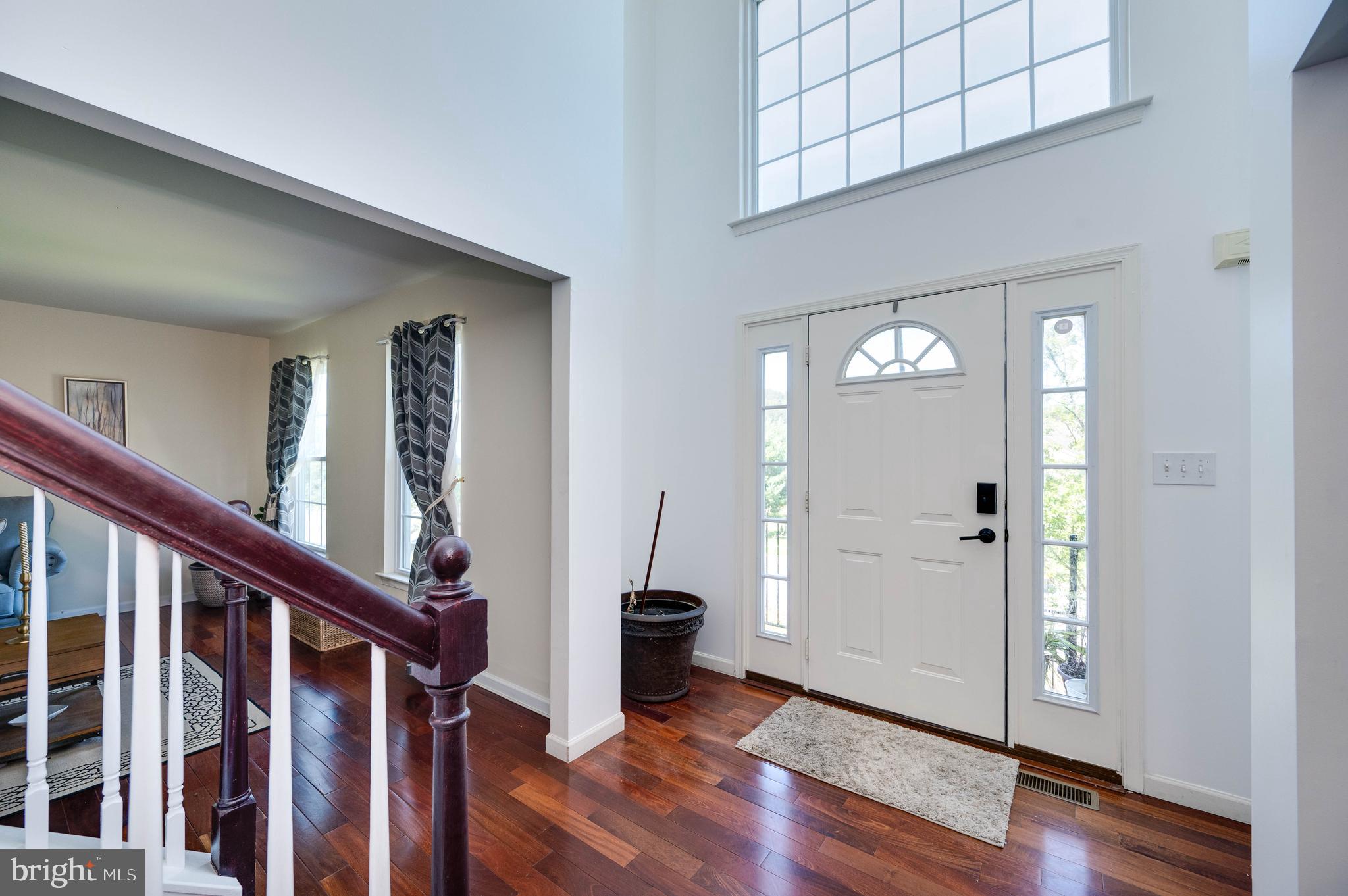 4660 Dunham Drive Reading, PA 19606 - Photo 4 of 48 a view of a hallway with wooden floor and stairs