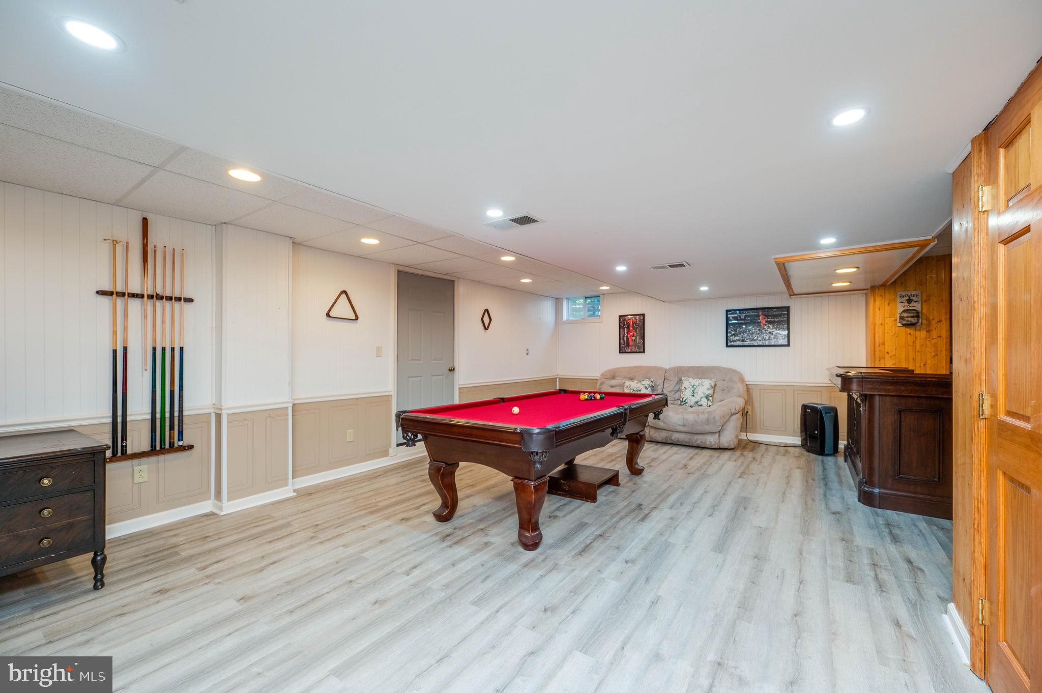 4660 Dunham Drive Reading, PA 19606 - Photo 41 of 48 a living room with a table tennis table and wooden floor