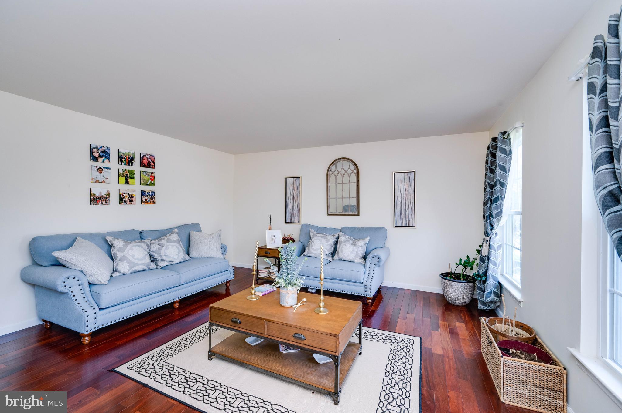 4660 Dunham Drive Reading, PA 19606 - Photo 7 of 48 a living room with furniture a rug and a wooden floor