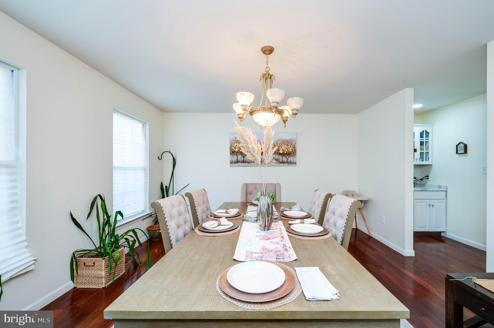 4660 Dunham Drive Reading, PA 19606 - Photo 9 of 48 a view of a dining room with furniture a chandelier and wooden floor
