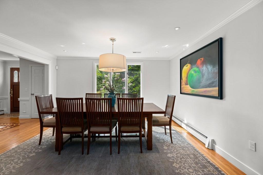 77 Royalston Road Wellesley, MA 02481 - Photo 11 of 30 a view of a dining room with furniture window and wooden floor