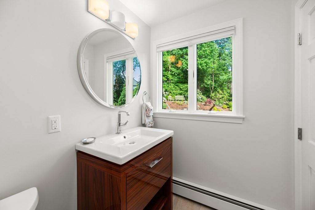 77 Royalston Road Wellesley, MA 02481 - Photo 14 of 30 a bathroom with a sink and a mirror