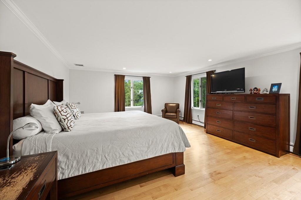77 Royalston Road Wellesley, MA 02481 - Photo 15 of 30 a spacious bedroom with a bed and dresser