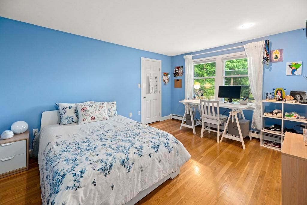 77 Royalston Road Wellesley, MA 02481 - Photo 17 of 30 a bedroom with a bed and large windows