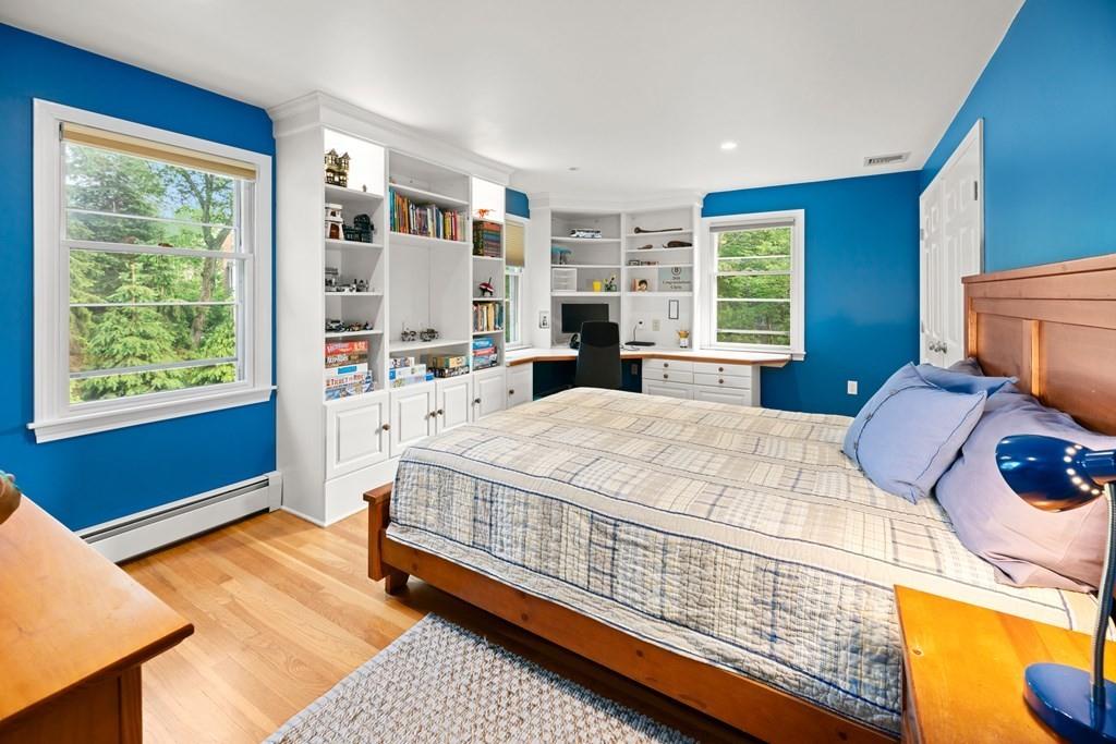 77 Royalston Road Wellesley, MA 02481 - Photo 19 of 30 a bed sitting in a bedroom next to a window