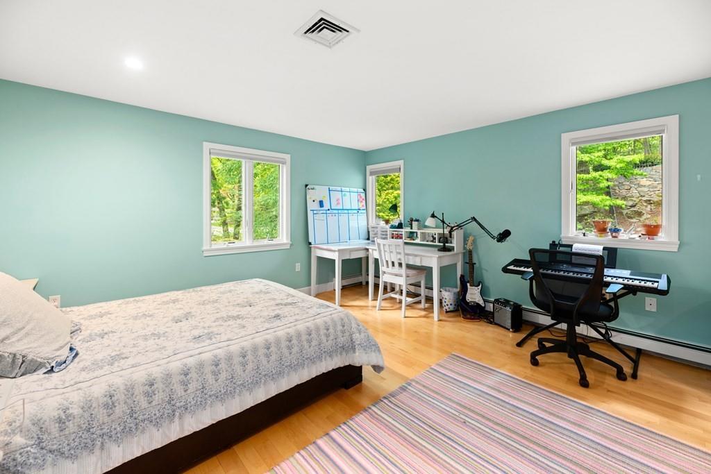 77 Royalston Road Wellesley, MA 02481 - Photo 21 of 30 a bedroom with a bed and a table