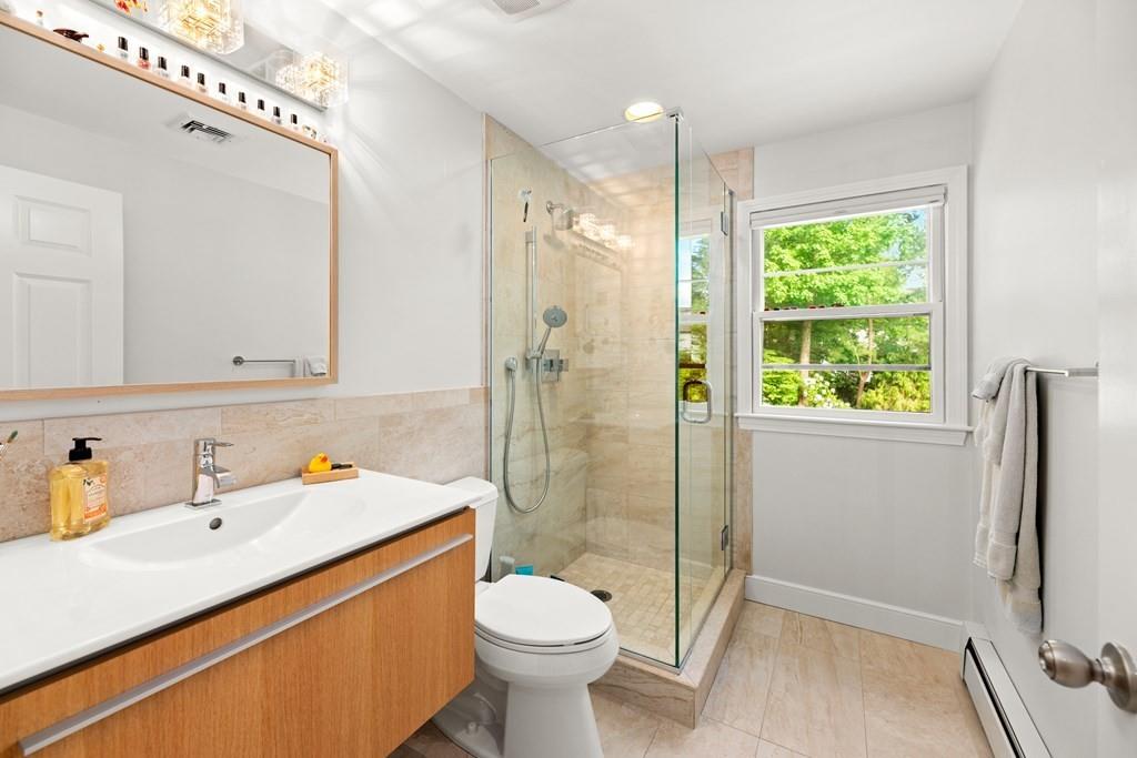 77 Royalston Road Wellesley, MA 02481 - Photo 22 of 30 a bathroom with a sink toilet and shower