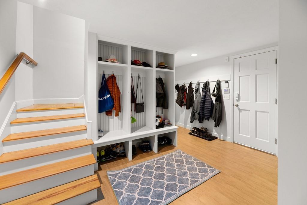 77 Royalston Road Wellesley, MA 02481 - Photo 23 of 30 a view of walk in closet with clothes and shoes