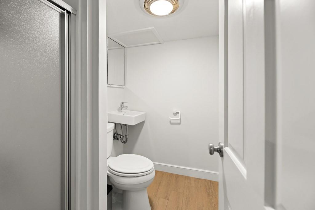 77 Royalston Road Wellesley, MA 02481 - Photo 24 of 30 a bathroom with a toilet a sink and vanity