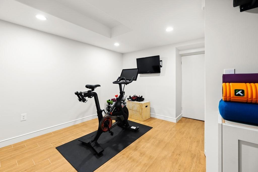 77 Royalston Road Wellesley, MA 02481 - Photo 25 of 30 a living room with furniture and a flat screen tv
