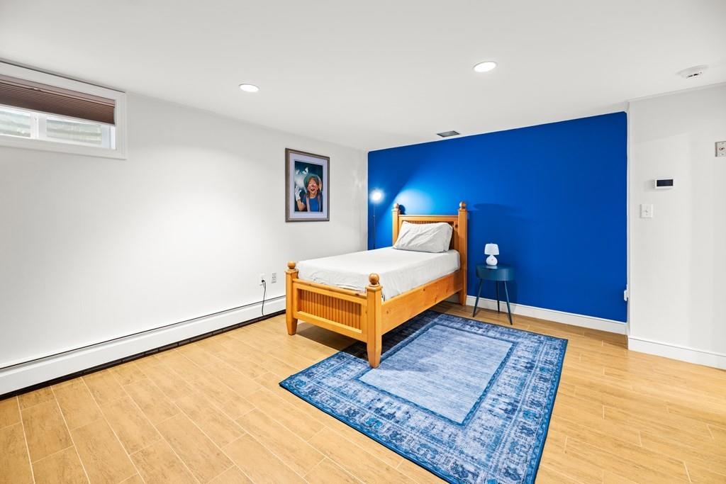 77 Royalston Road Wellesley, MA 02481 - Photo 26 of 30 a bedroom with a bed and a rug