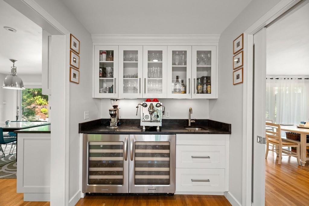 77 Royalston Road Wellesley, MA 02481 - Photo 8 of 30 a kitchen with granite countertop a sink and cabinets