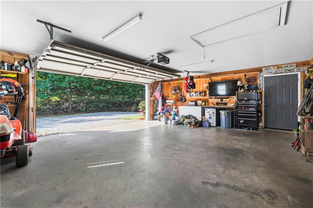 2777 Chickadee Drive Monroe, GA 30655 - Photo 30 of 36 a view of a garage with furniture and a large window