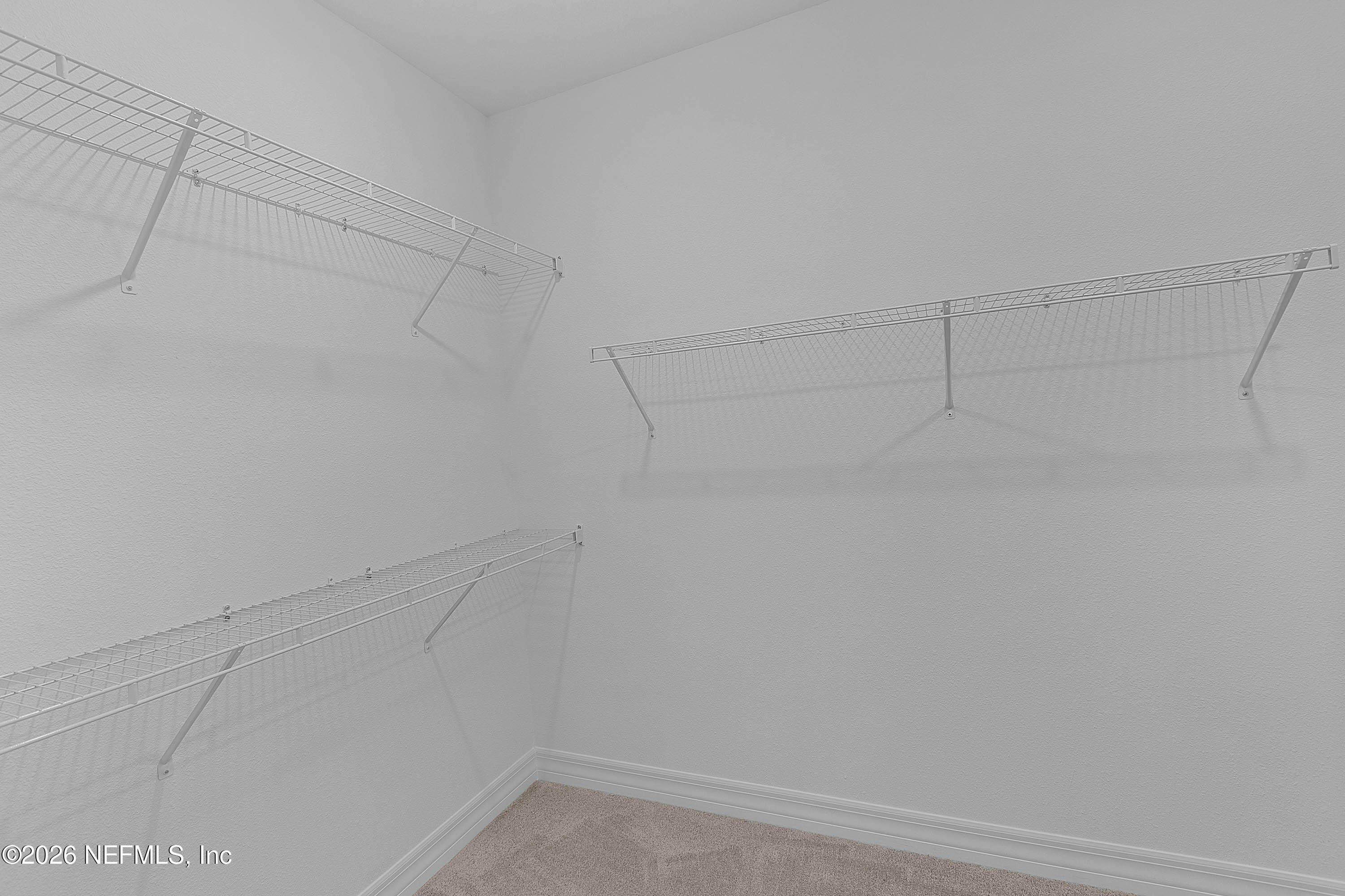 4963 Shell Crk Trail Jacksonville, FL 32226 - Photo 11 of 39 a view of a room with racks on the wall