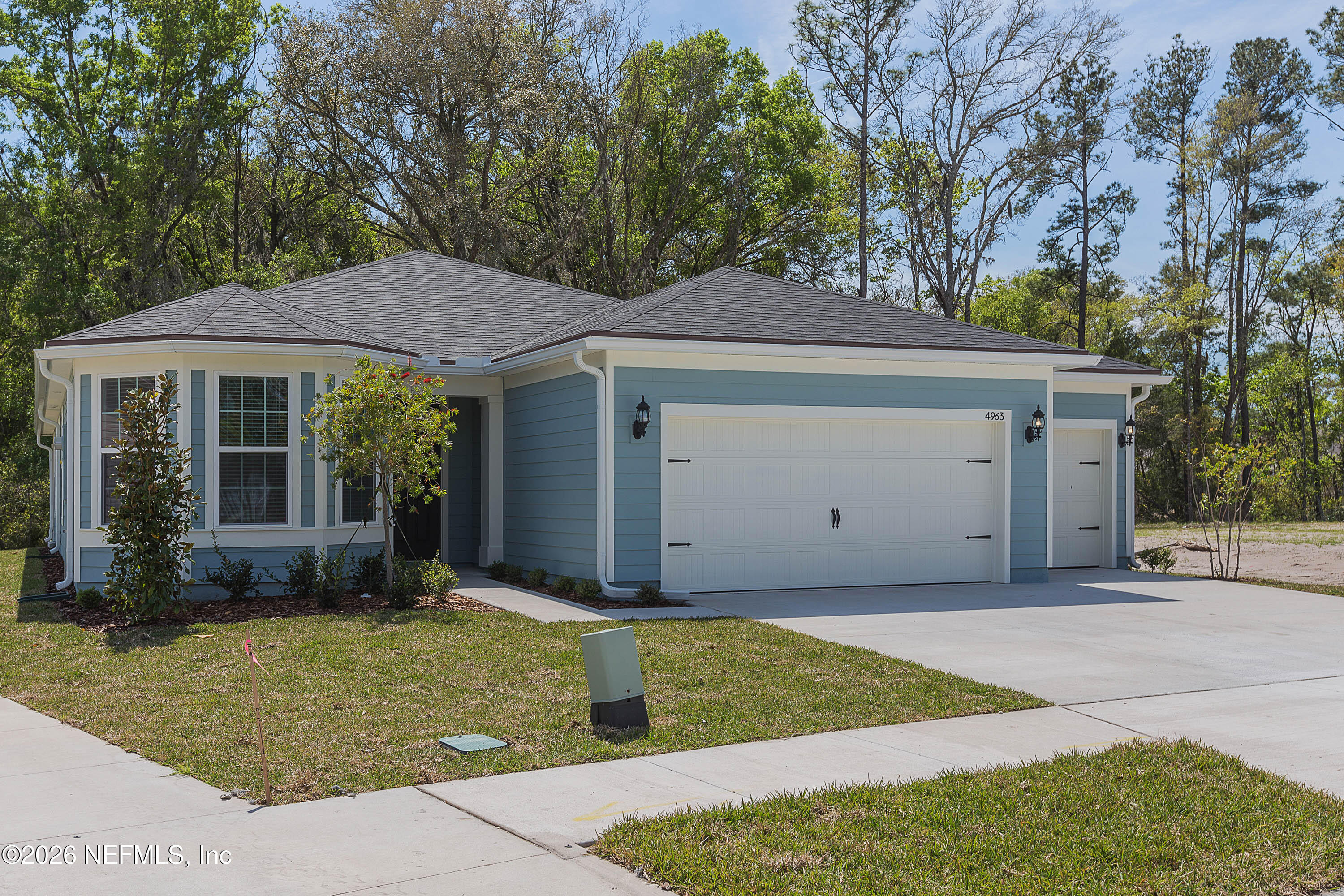 4963 Shell Crk Trail Jacksonville, FL 32226 - Photo 2 of 39 a front view of a house with garden