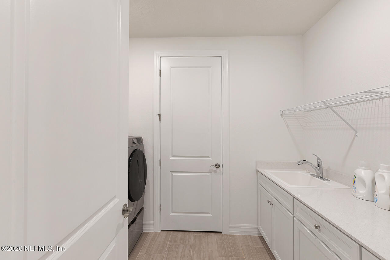4963 Shell Crk Trail Jacksonville, FL 32226 - Photo 21 of 39 a bathroom with a sink and mirror